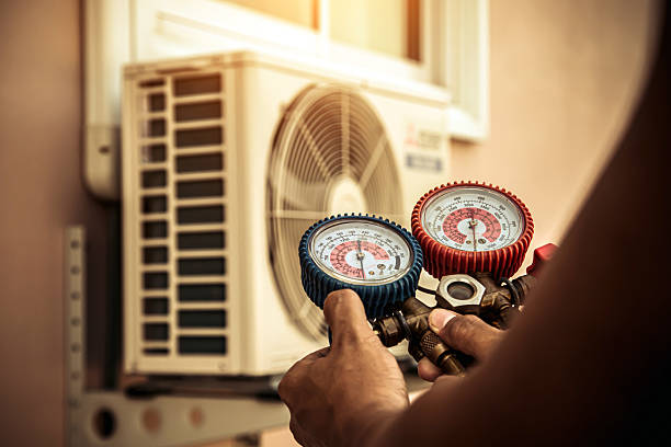 Professional Air Conditioning Service technician working in Lambertville, MI